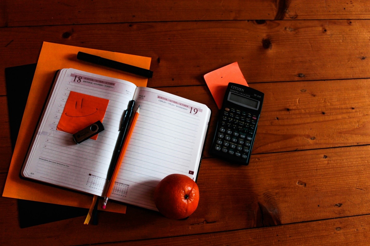 A calculator and notebook