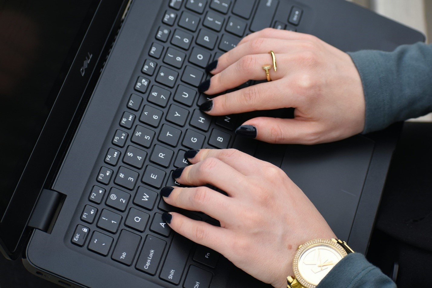 A person using their laptop
