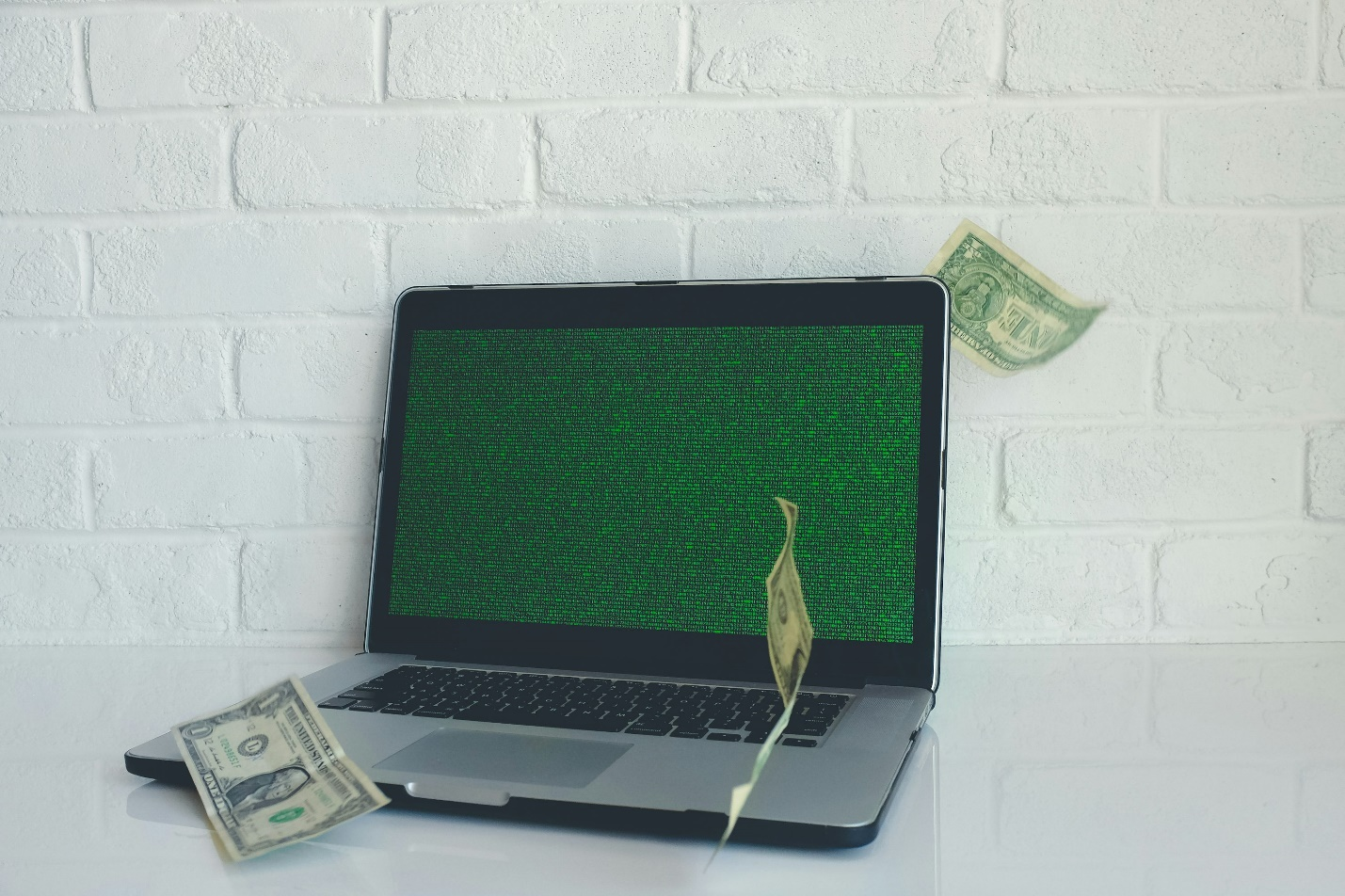 A laptop and money